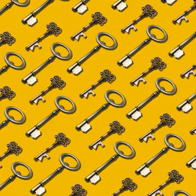Graphic of repeating old-fashioned keys laid out diagonally against a bright yellow background